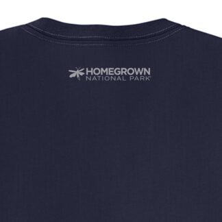 Close-up of a navy blue T-shirt featuring the "Homegrown National Park" logo with a bee icon, showcasing inspirational merchandise supporting conservation efforts.